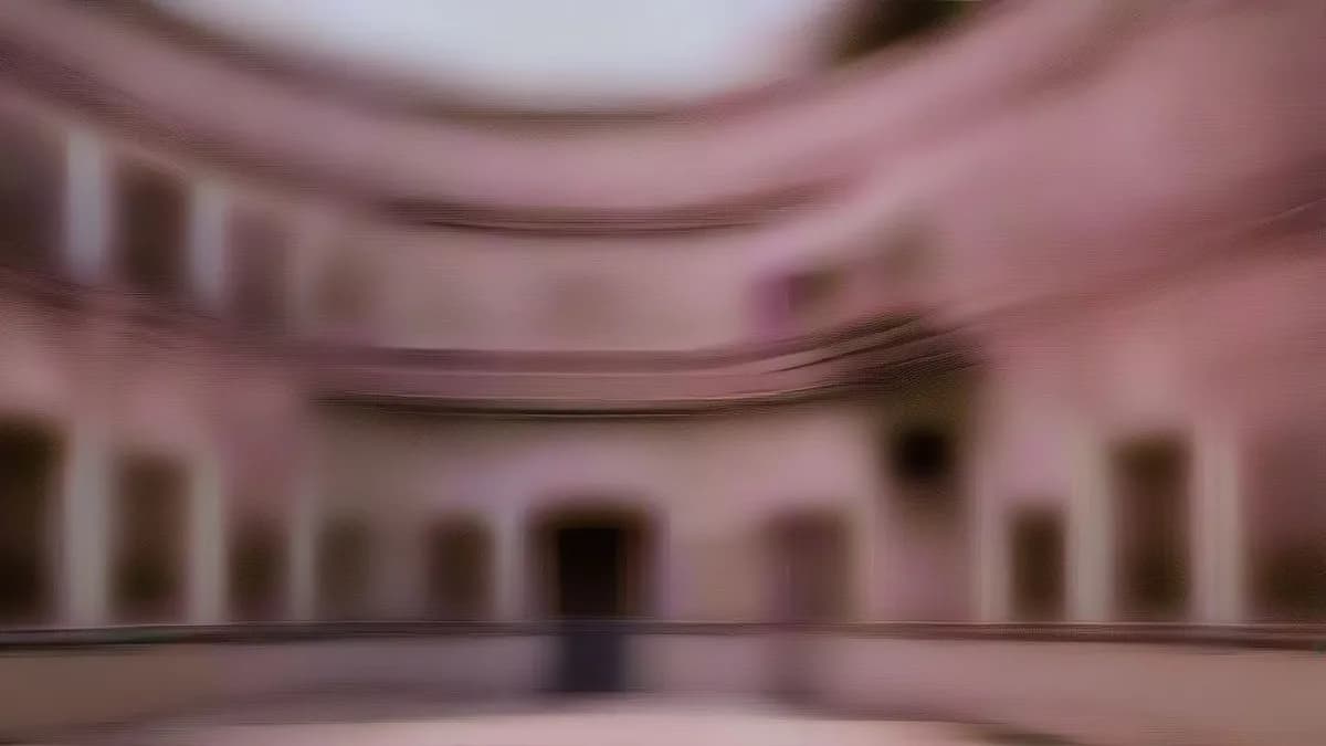 Exterior view of Bikaner House in New Delhi at dusk.