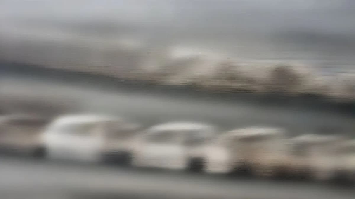 Vehicles moving through smoggy streets in New Delhi during GRAP-1 implementation