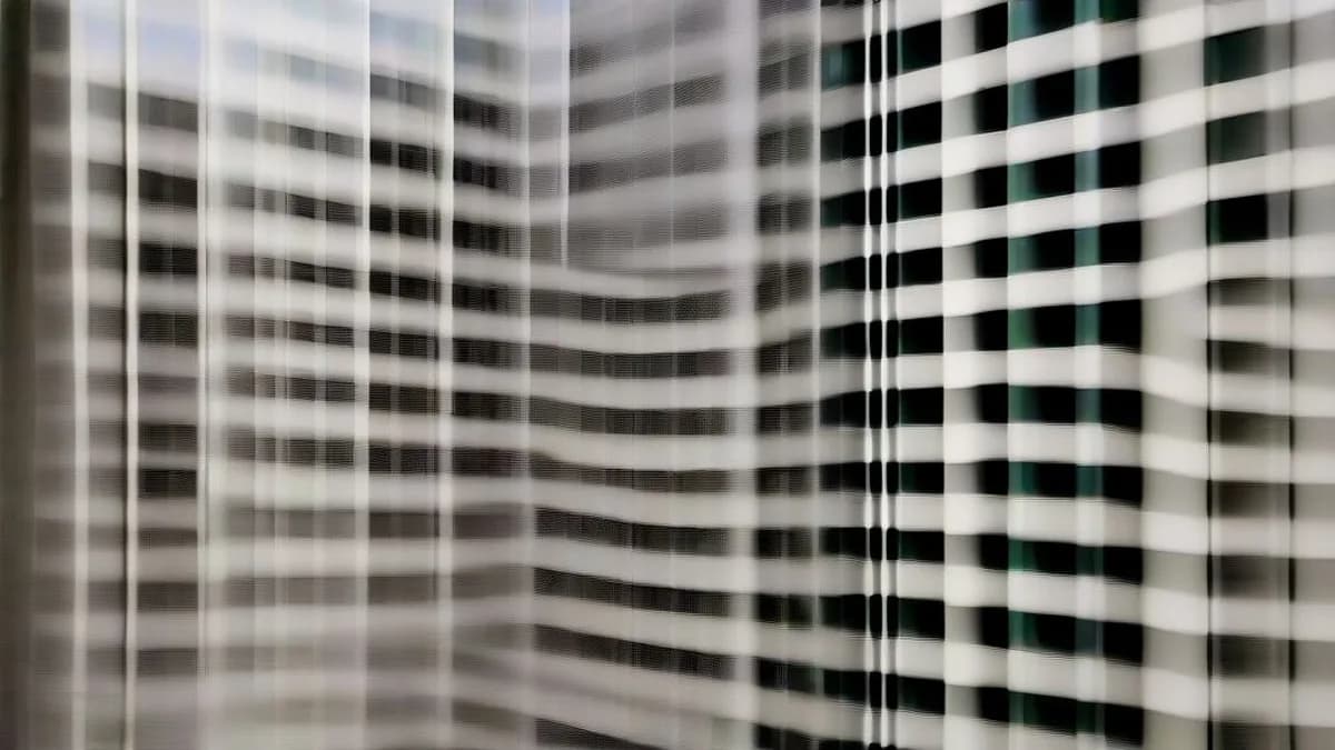 Exterior facade of the United States District Court building in Washington D.C. under overcast skies.