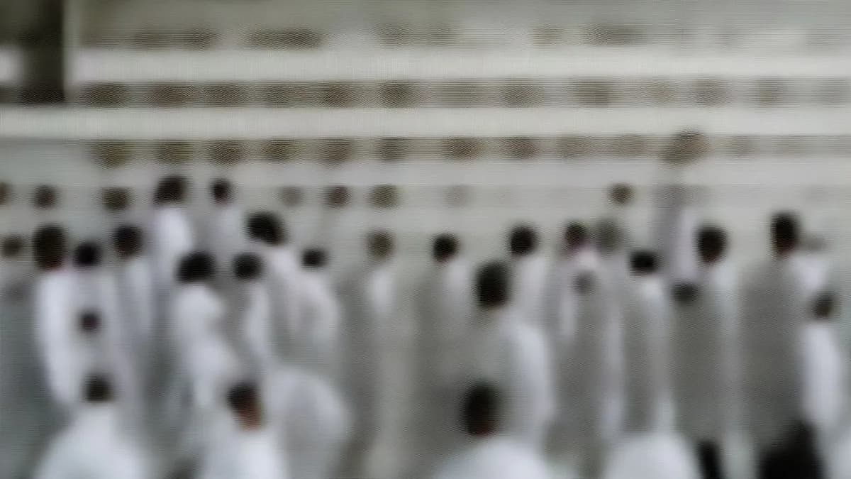 Medical interns in white coats standing outside a hospital in Jammu and Kashmir