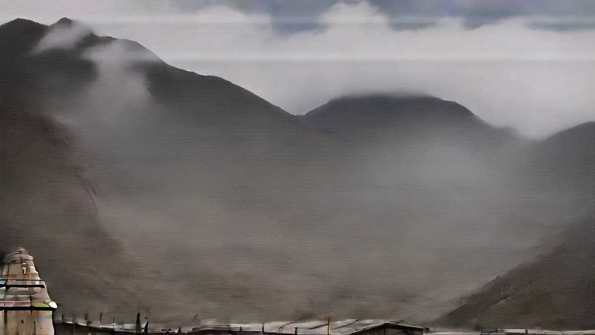 The historic stone architecture of Kedarnath temple against Himalayan peaks