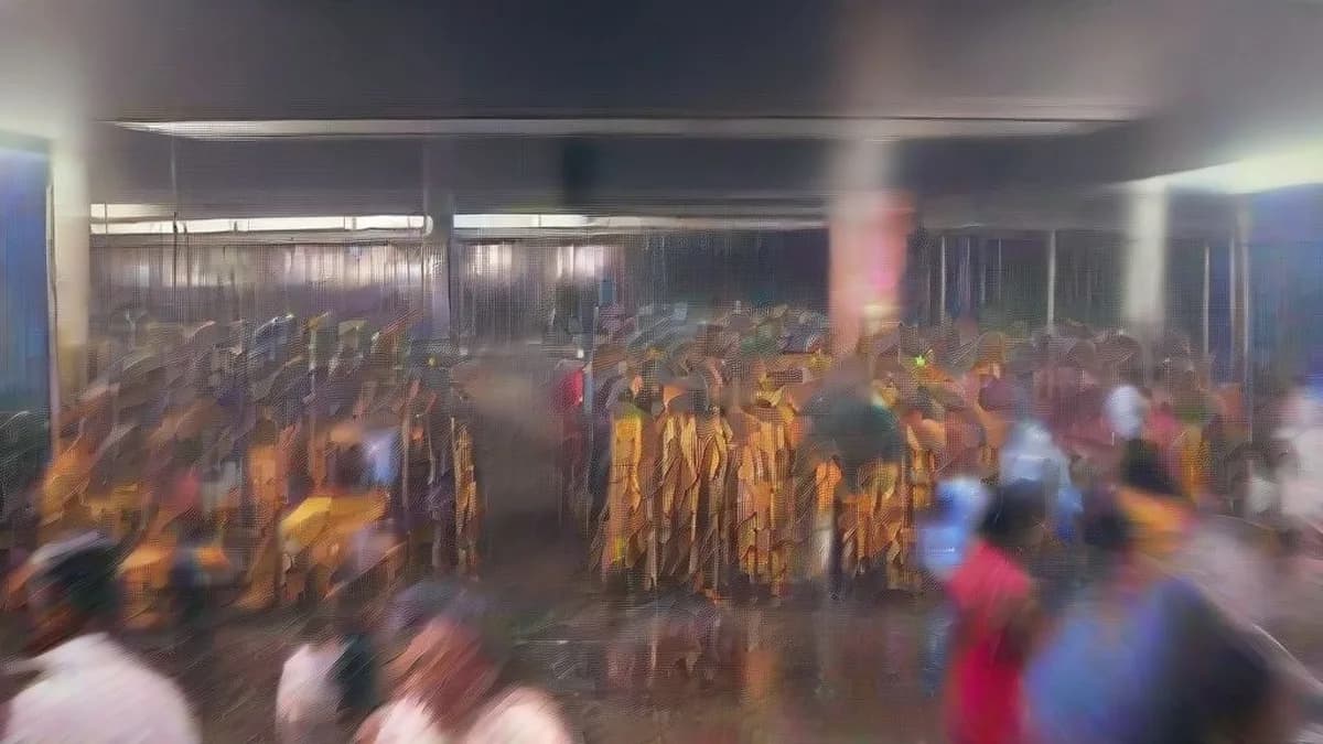 A state transport bus parked at a depot during evening rain in Tamil Nadu