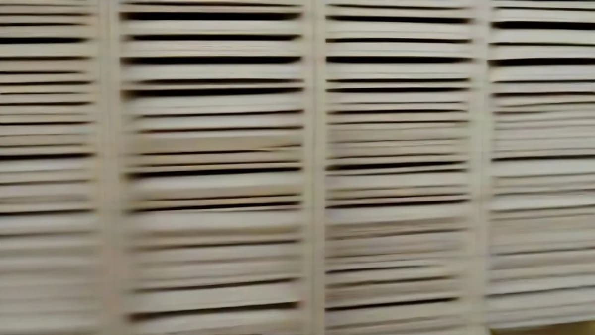 An academic research office with archival files and books representing scientific inquiry.