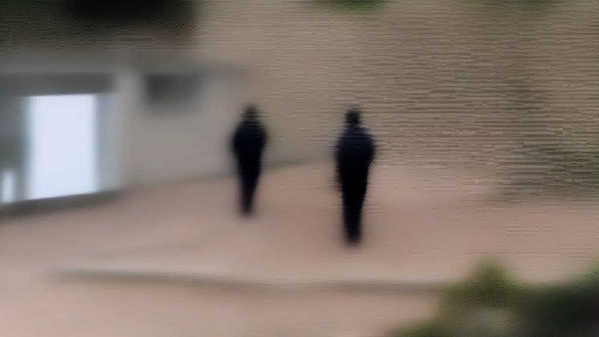 Police officers and investigators gathered near a residential area in Udhampur following a fatal crime.